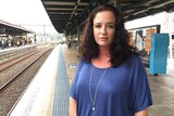 Justine Watson standing on a train platform