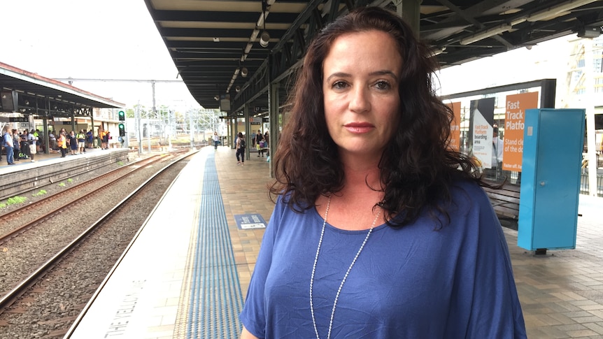 Justine Watson standing on a train platform