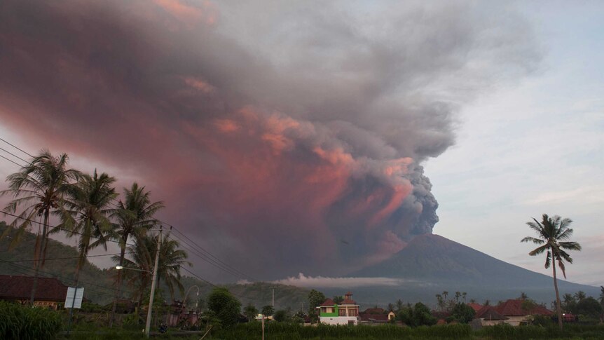 Plumes of red and black ash pour into the sky from Mt Agung in Bali, Indonesia.