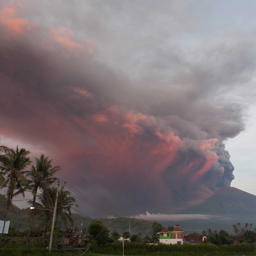 Plumes of red and black ash pour into the sky from Mt Agung in Bali, Indonesia.