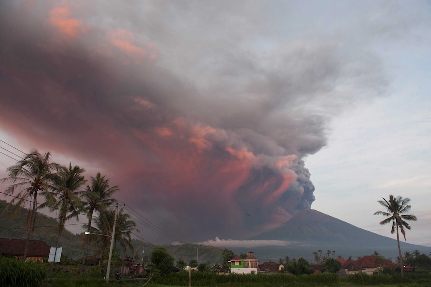 Plumes of red and black ash pour into the sky from Mt Agung in Bali, Indonesia.