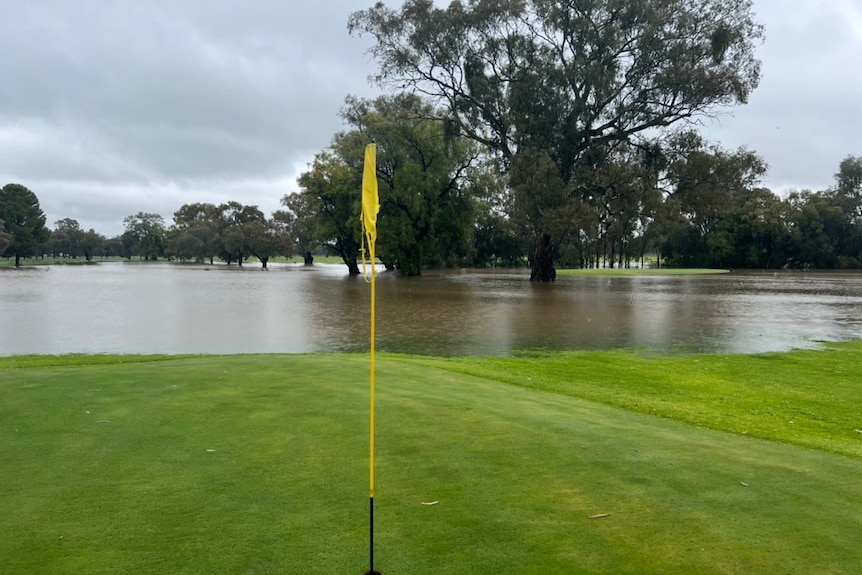 Half the green of the golf course is covered with water.