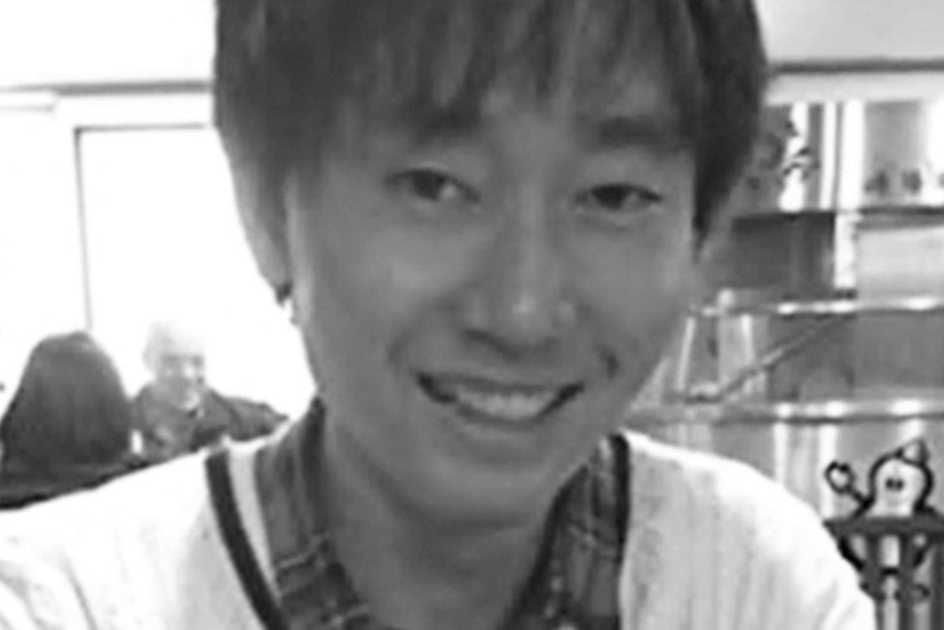 Yosuke Kanno smiles at the camera.
