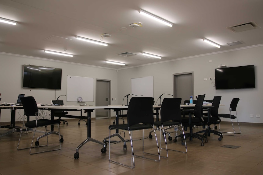 Tables and chairs are left empty after a busy day at Bush Court in Wadeye