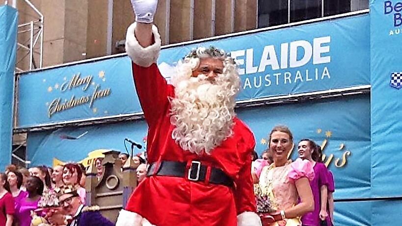 Father Christmas waves to the crowd