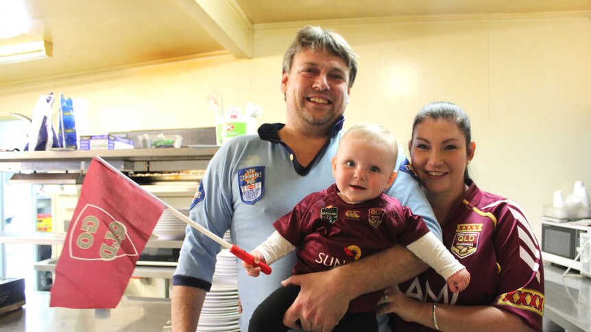 Andrew and Jodie Watts with their daughter Abigail in the kitchen at the Longreach RSL.