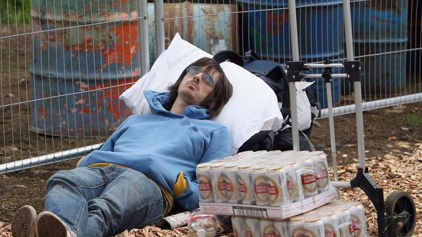 Alll over: A festivalgoer sleeps at the Glastonbury music festival.