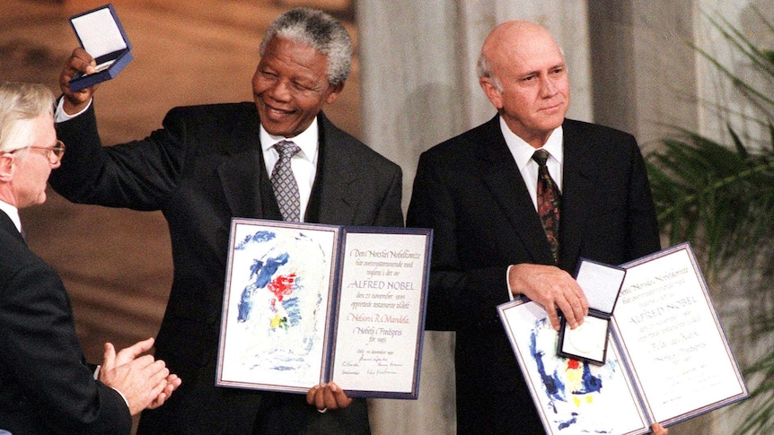 Nelson Mandela and Frederik de Klerk with Nobel Peace Prizes.