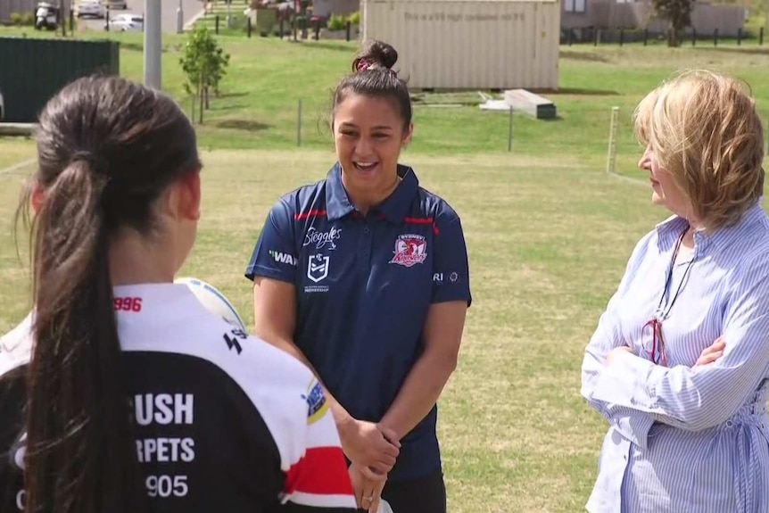 Female athletes talking in a group