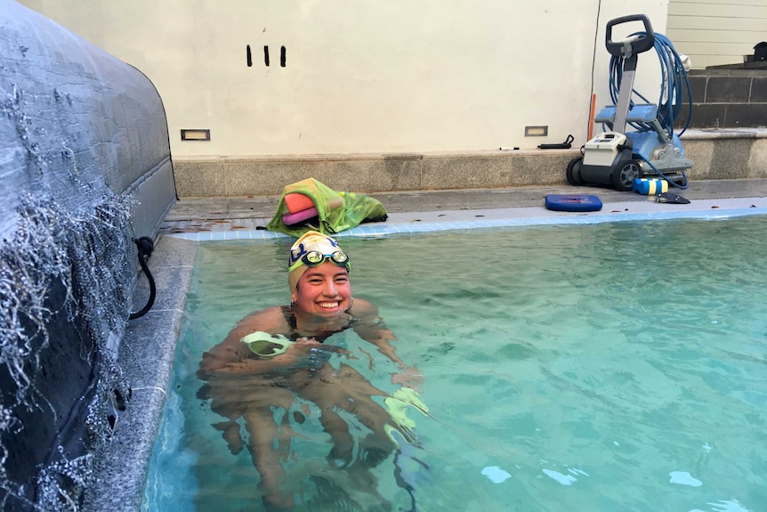 Kimberly in a swimming pool.