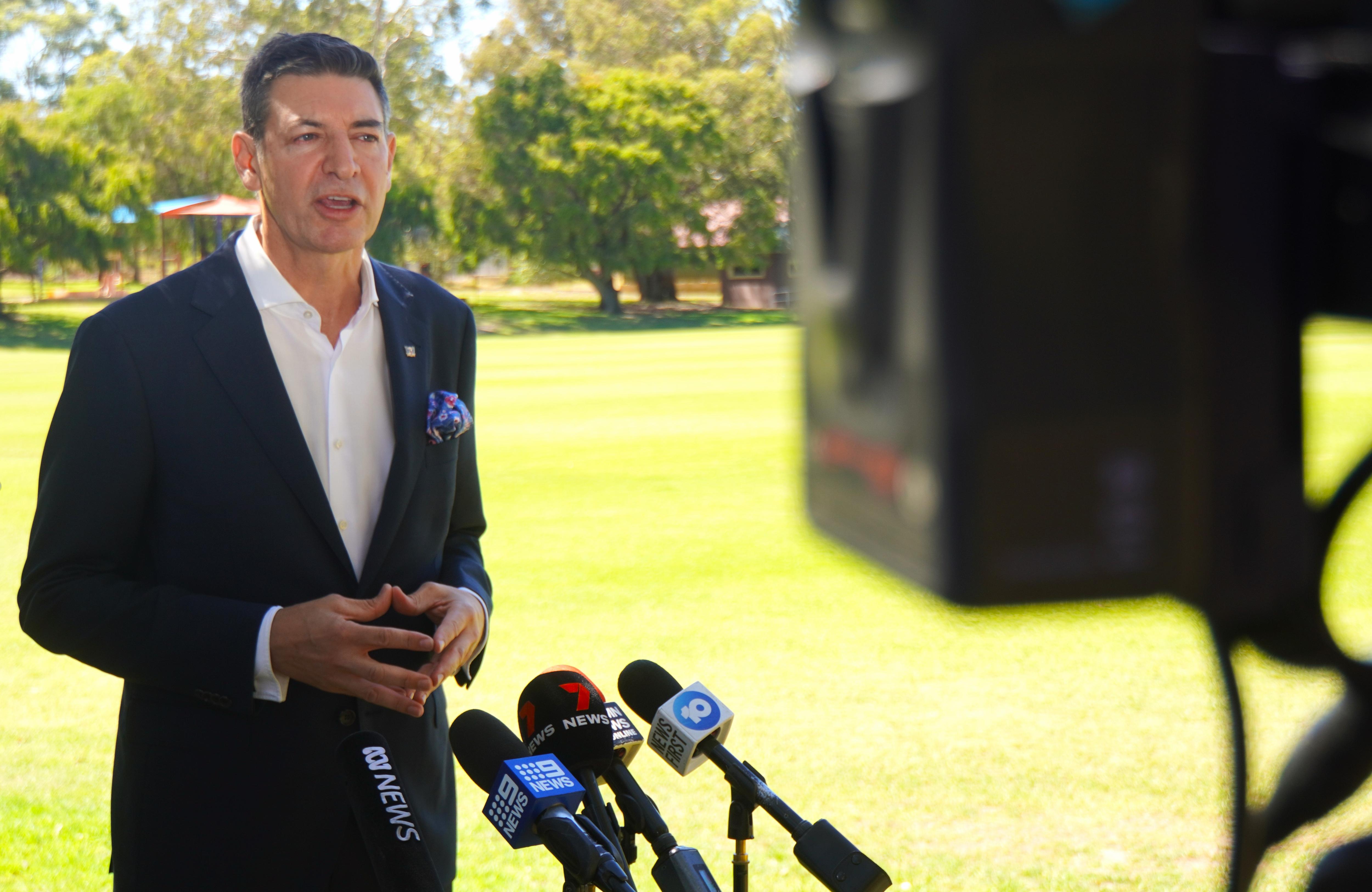 A man standing in front of a camera.