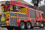 Fire engine viewed from side and rear.