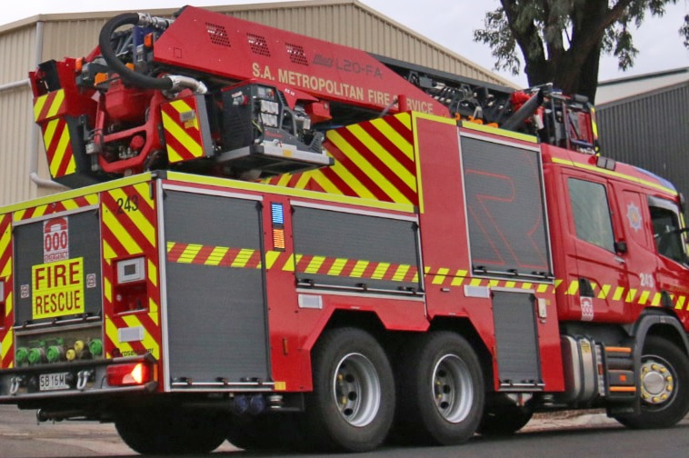 Fire engine viewed from side and rear.