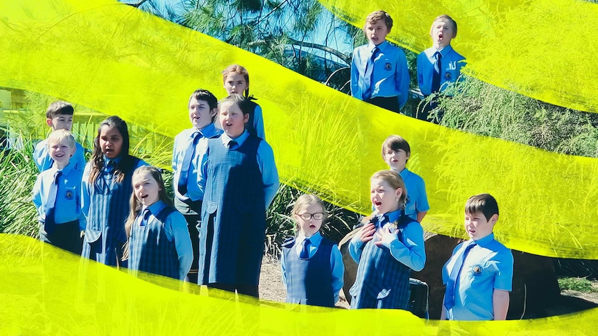 A group of 13 students in their school garden choir singing.