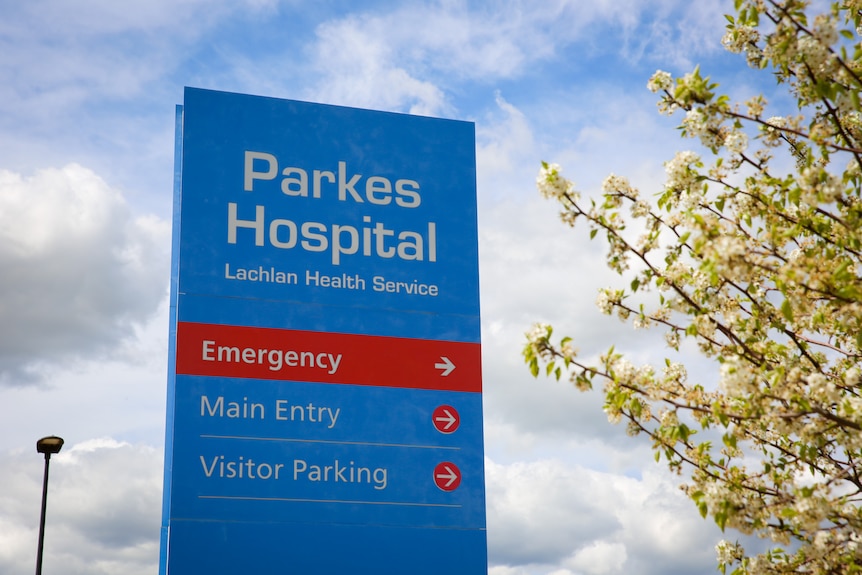 Parkes hospital sign with blossom tree in foreground
