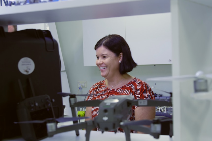 Health Minister Natasha Fyles smiles while reviewing the drone technology.