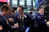 Wall Street traders in a happy mood, cheering Wall Street's strong gains.