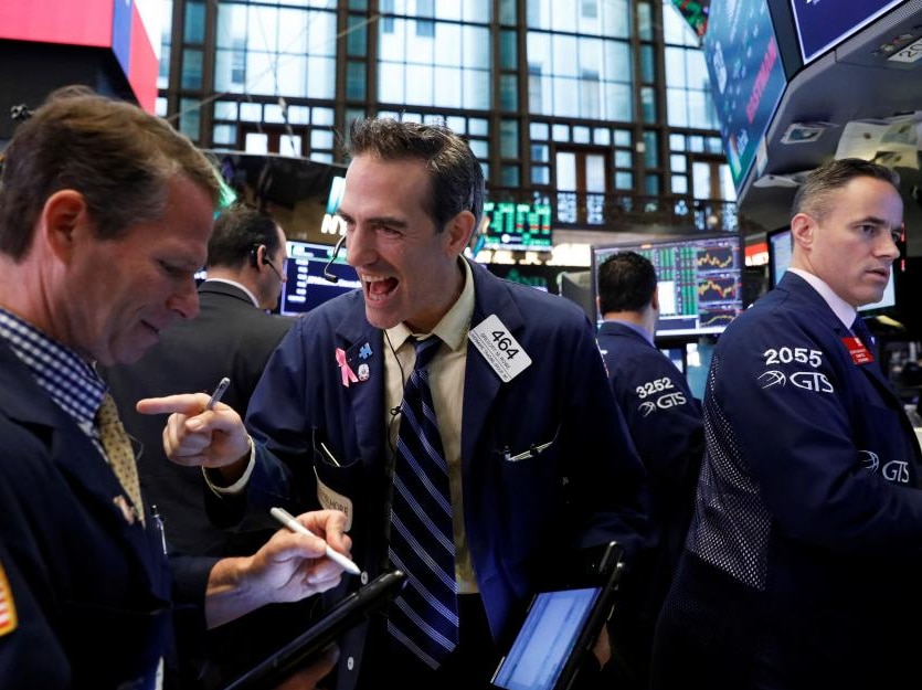 Wall Street traders in a happy mood, cheering Wall Street's strong gains.