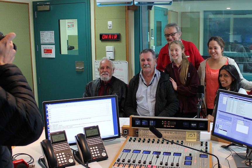 Readers for the recording of the Aboriginal language app being photographed by local media