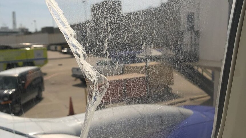 Broken window on a Southwest Airlines flight. A few layers were lost but it did not crack all the way.