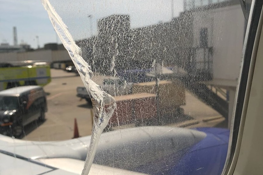 Broken window on a Southwest Airlines flight. A few layers were lost but it did not crack all the way.