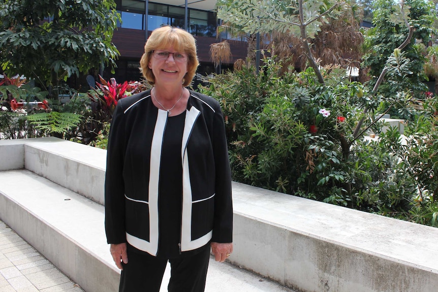 CSU Head of Campus Professor Heather Cavanagh standing in front of campus garden.