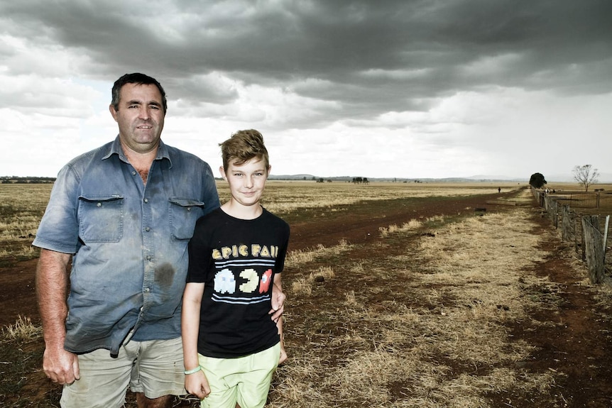 Farmer Mark Brasser and his son Aiden stand on their property at Baringhup West in Central Victoria.