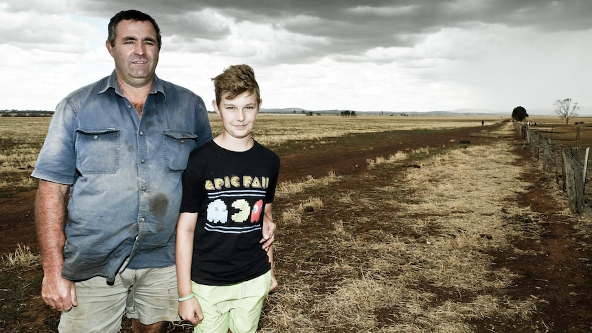 Farmer Mark Brasser and his son Aiden stand on their property at Baringhup West in Central Victoria.
