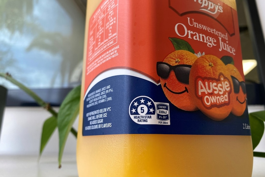 A orange juice bottle with health star rating.