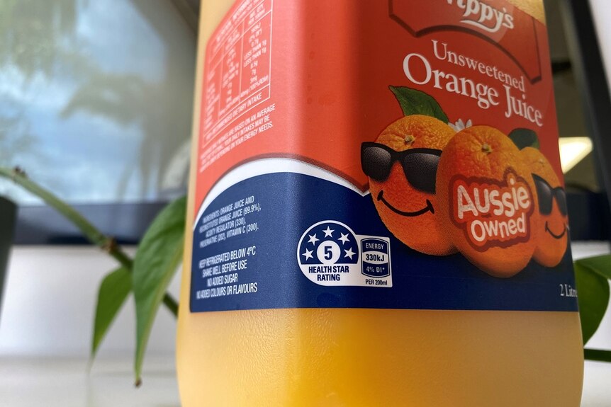 A bottle of orange juice that bears a five-star health rating.