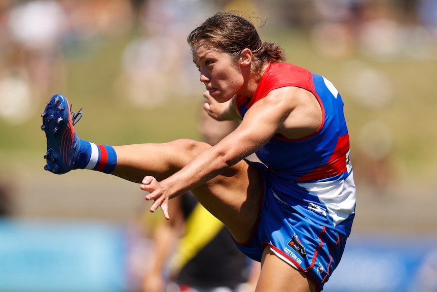 Ellie Blackburn follows through with a kick for the Bulldogs 