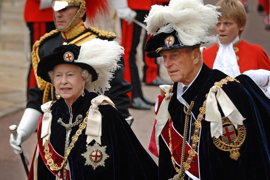 Queen Elizabeth II (L) and Prince Philip arrive at St George's Chapel