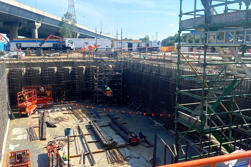 Scaffolding and construction works in a big square pit at Docklands.