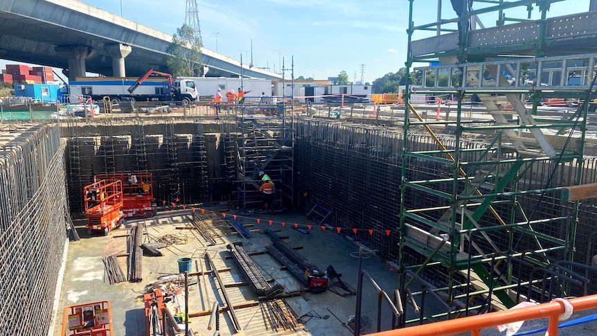 Scaffolding and construction works in a big square pit at Docklands.