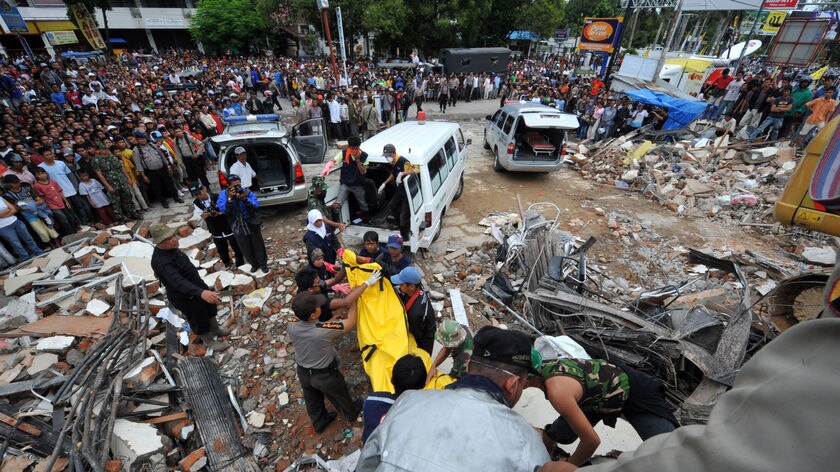 Race against time: Hundreds are believed to still be trapped under collapsed buildings.