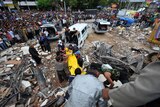 Rescuers search collapsed buildings in West Sumatra