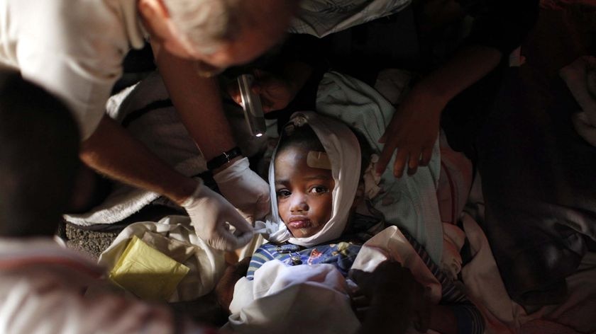 An injured child receives medical treatment