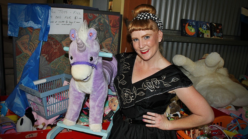 Angie Wright and a toy unicorn