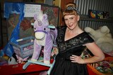 Angie Wright and a toy unicorn