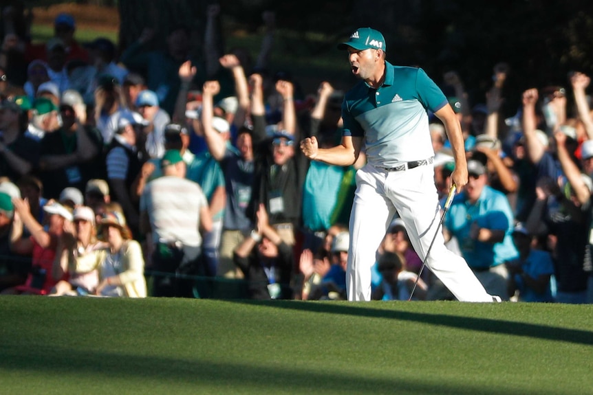 Masters champion Sergio Garcia celebrates an eagle putt on the 15th hole.