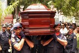 East Timorese officials carry a coffin holding Francisco Xavier do Amaral in Dili.