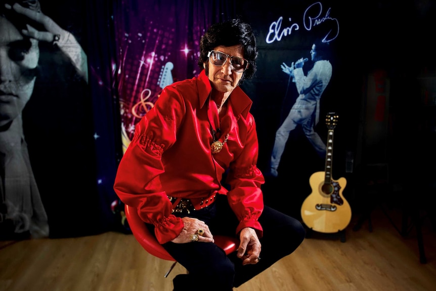 Elvis tribute artist Rod Toovey sitting on chair
