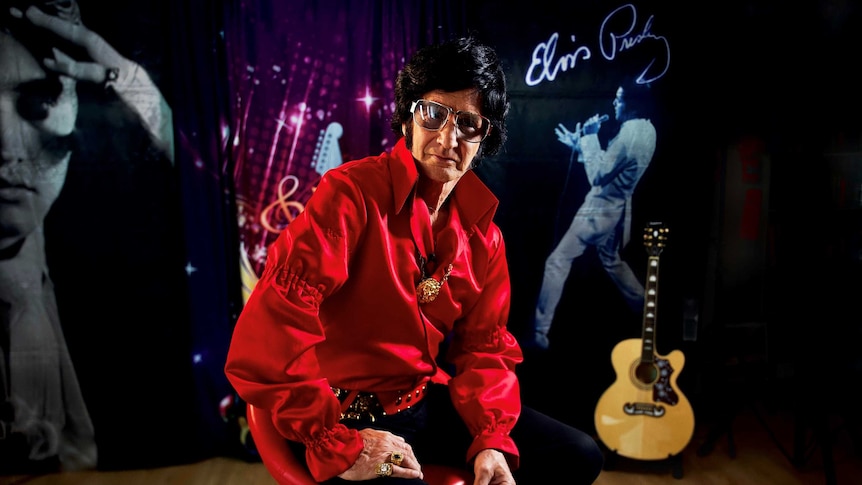 Elvis tribute artist Rod Toovey sitting on chair