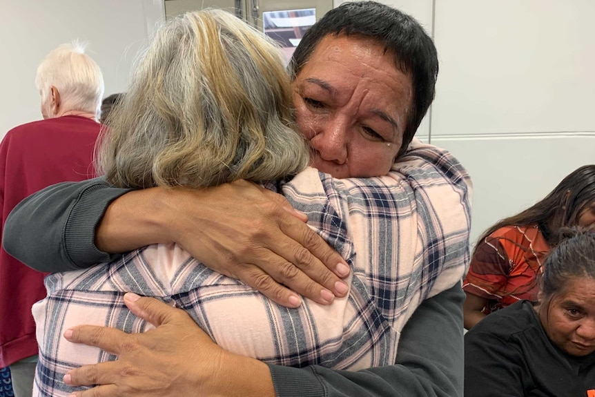 Two woman emotional and hugging.