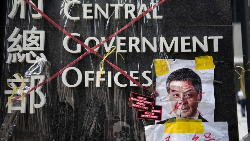 Hong Kong protests defaced Leung pic