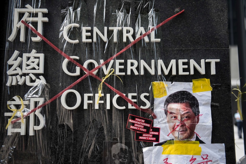 Hong Kong protests defaced Leung pic