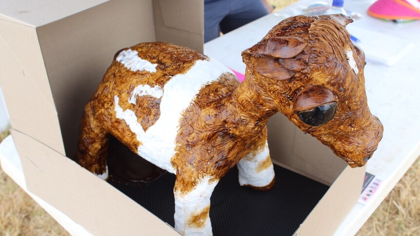 A cake in the shape of a cow.