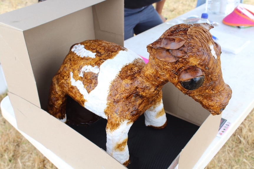 A cake in the shape of a cow.