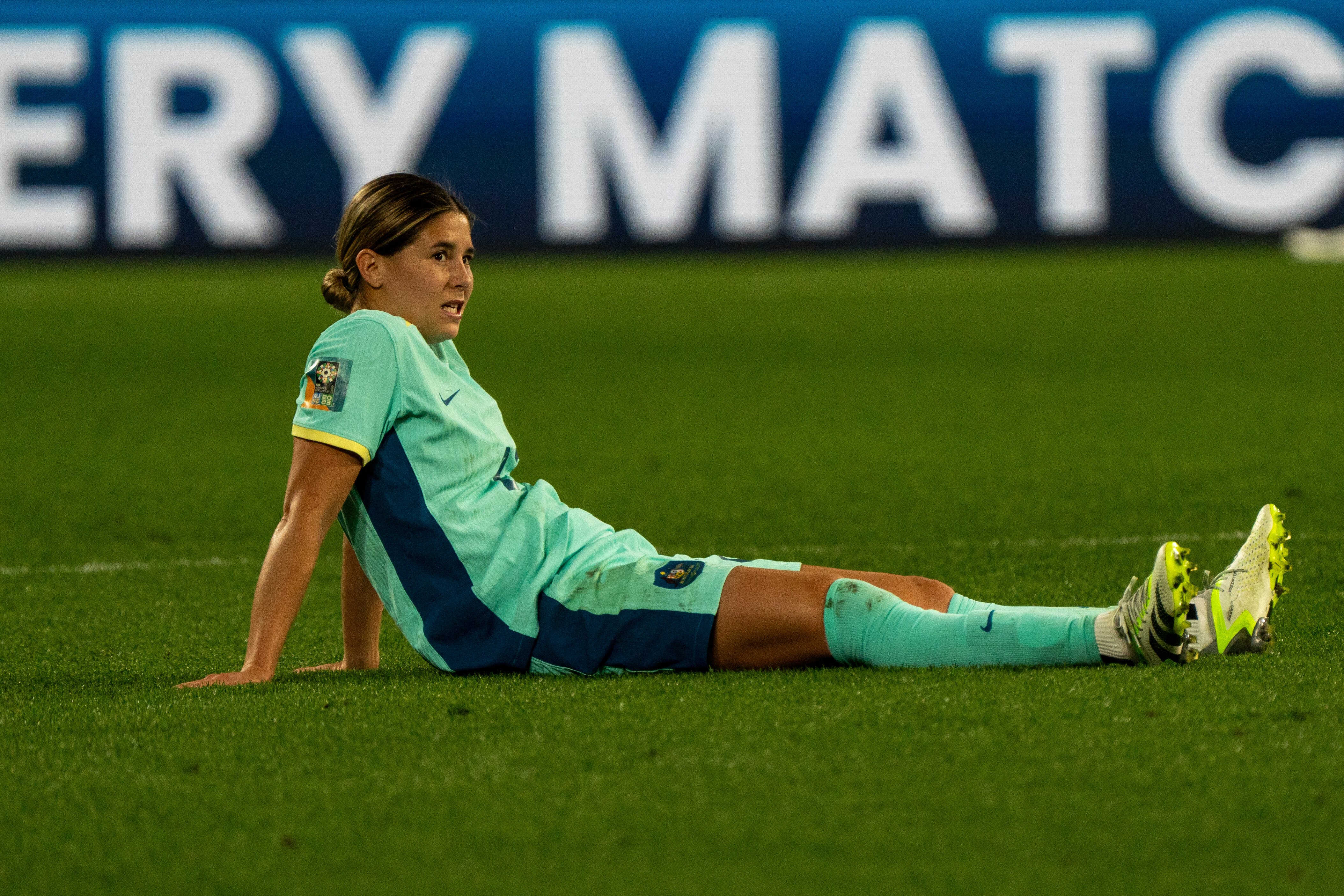 Matildas' Kyra Cooney-Cross sits on the grass after losing the third=place playoff to Sweden at the Women's World Cup..