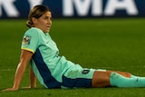 Matildas' Kyra Cooney-Cross sits on the grass after losing the third=place playoff to Sweden at the Women's World Cup..